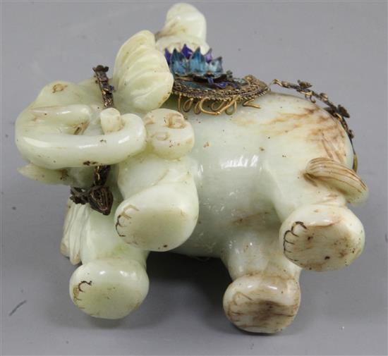 A Chinese celadon jade and filigree work group of Buddha riding an elephant, early 20th century, total height 14.5cm, length 9.8cm